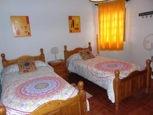 Postel nebo postele na pokoji v ubytování Casa Rosa