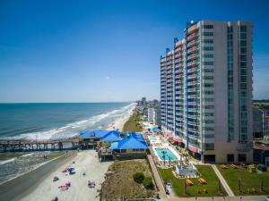 a view of a beach with a tall building at Prince Resort in Myrtle Beach