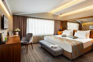 Postel nebo postele na pokoji v ubytování Artur Hotel