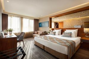 Postel nebo postele na pokoji v ubytování Artur Hotel