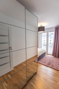 Ένα ή περισσότερα κρεβάτια σε δωμάτιο στο Apartament Soft 14