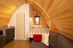 a room with a bed in a small room at Evelix Pods Dornoch in Dornoch