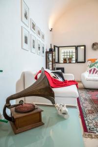 a living room with a treadmill on a table at Antico Granaio in Sciacca