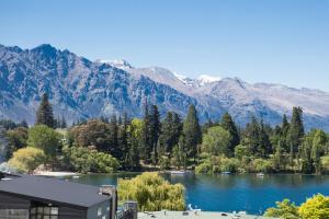 a view of a lake with mountains in the background at Lomond Lodge Motel & Apartments in Queenstown