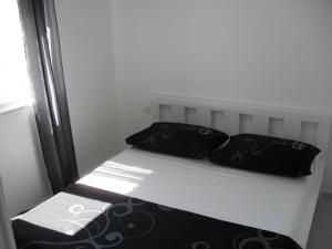 Postel nebo postele na pokoji v ubytování Apartments Govic