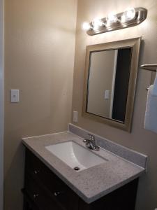 a bathroom with a sink and a mirror at Beverly Lodge in South Lake Tahoe