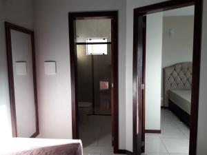 Cama o camas de una habitación en Residencial Franca Garopaba