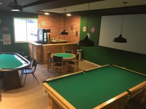 a ping pong room with a pool table in it at Condado - Condomínio Aldeia dos Reis - Sahy - BL03 AP101 in Mangaratiba
