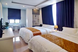 Кровать или кровати в номере Thiên An Hotel
