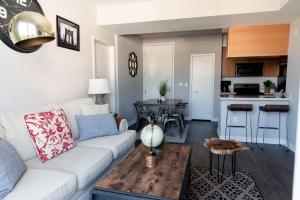 a living room with a white couch and a table at Santa Monica 2 Bed/ 2 Bath in Los Angeles
