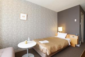 Postelja oz. postelje v sobi nastanitve Hotel Grand Vert Gizan