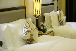 Cama o camas de una habitación en Empark Hotel Fuzhou Exhibition Centre