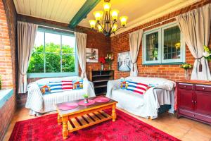 a living room with two chairs and a table at The Ocean Breeze CBD in Timaru