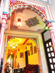 an entrance to a room with an archway in a building at Kalyan Heritage in Jaipur