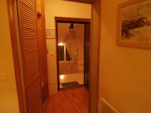 a hallway with a mirror and stairs in a room at Apartment studio Mia-beach in Split in Split +47 photos