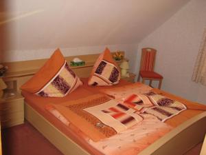 a bedroom with a bed with pillows on it at Ferienwohnung Klement in Neubukow