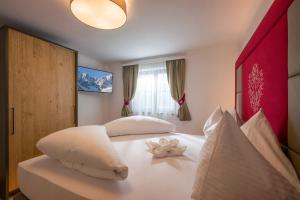 Voodi või voodid majutusasutuse Kaiser Chalet toas
