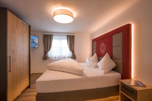 Voodi või voodid majutusasutuse Kaiser Chalet toas