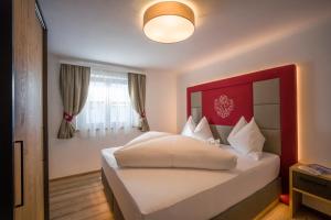 Voodi või voodid majutusasutuse Kaiser Chalet toas