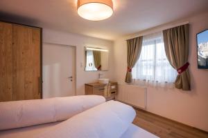Voodi või voodid majutusasutuse Kaiser Chalet toas