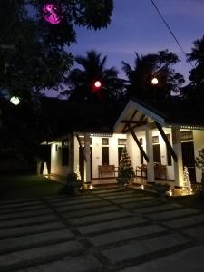 a house with a christmas tree in front of it at Sayo Villa in Negombo