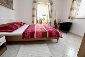 Postel nebo postele na pokoji v ubytování Apartmani Vuljan