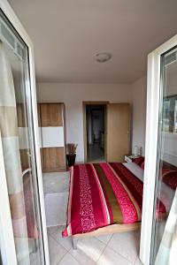 Postel nebo postele na pokoji v ubytování Apartmani Vuljan