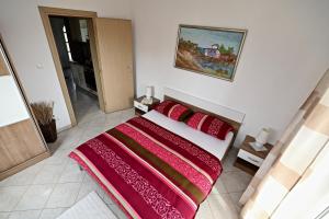 Postel nebo postele na pokoji v ubytování Apartmani Vuljan