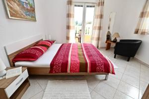 Postel nebo postele na pokoji v ubytování Apartmani Vuljan
