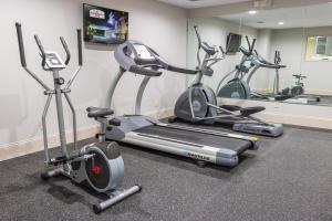 a gym with several exercise bikes in a room at Admiral's Inn on Tybee Island in Tybee Island