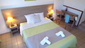 Ένα ή περισσότερα κρεβάτια σε δωμάτιο στο VVF Cantal Salers Vendes