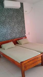 Postel nebo postele na pokoji v ubytování Masha Beach Inn