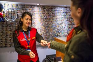 a woman shaking hands with a man in a room at LEGOLAND(R) Windsor Resort in Windsor