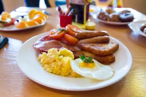 a plate of breakfast food on a table at LEGOLAND(R) Windsor Resort in Windsor