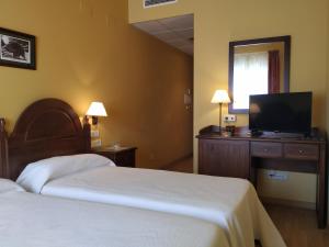 Postel nebo postele na pokoji v ubytování Hotel Sierra de Andujar