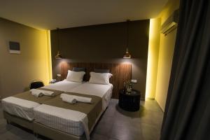 
Een bed of bedden in een kamer bij Golden Star Hotel - Adults Only (+16)
