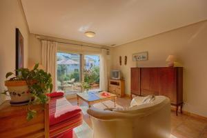 a living room with a couch and a table at Villas Guzman - Chirla in Calpe