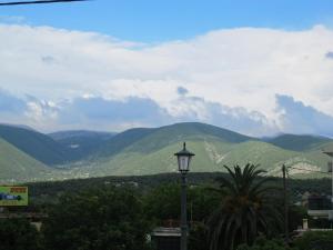 a street light with mountains in the background at Muses Studios Sami in Sami