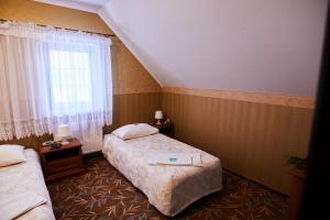 Ένα ή περισσότερα κρεβάτια σε δωμάτιο στο Zielony Zakątek