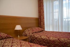 Pereslavl Hotel tesisinde bir odada yatak veya yataklar