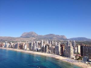 a view of a city with buildings and the ocean at Apartamentos Buenos Aires By Mc in Benidorm