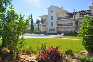 a large building with a yard and a pool at Bogart at Casablanca by OCvillas in Albufeira