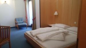 Postel nebo postele na pokoji v ubytování Hotel Brandl
