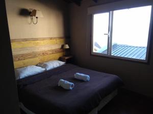 Postel nebo postele na pokoji v ubytování Bariloche Hostel