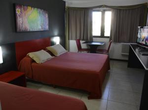 Ένα ή περισσότερα κρεβάτια σε δωμάτιο στο Apart Hotel Alvear