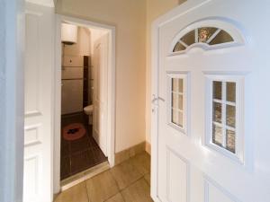 a door leading into a bathroom with a shower at Apartment Ema in Belgrade +11 photos