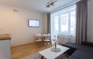 Posezení v ubytování Violetos Lux Apartamentai2