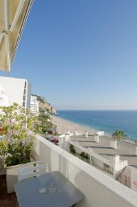 Un balcón o terraza de Apartamento frente à praia