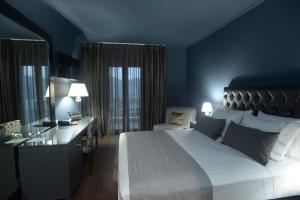 Theasis Hotel Paramythia客房内的一张或多张床位