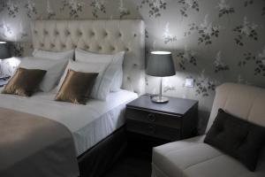 Theasis Hotel Paramythia客房内的一张或多张床位